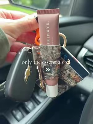 TikTok post by @itsreviewsbykate for Thread Wallets. Caption reads: [...] cash, lip gloss, hair tie, keys 🔑 @Thread....