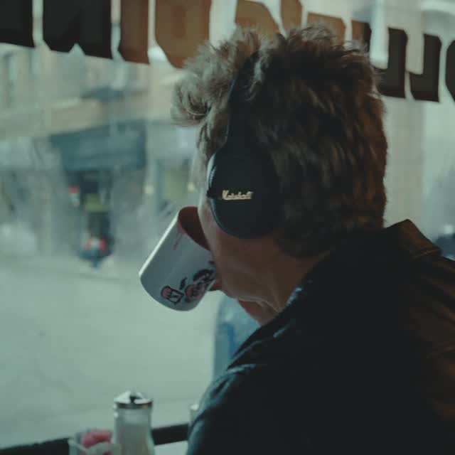 Instagram post by @guitarworldmagazine for Marshall Headphones. Caption reads: Find harmony in chaos. Embrace the head-turning....