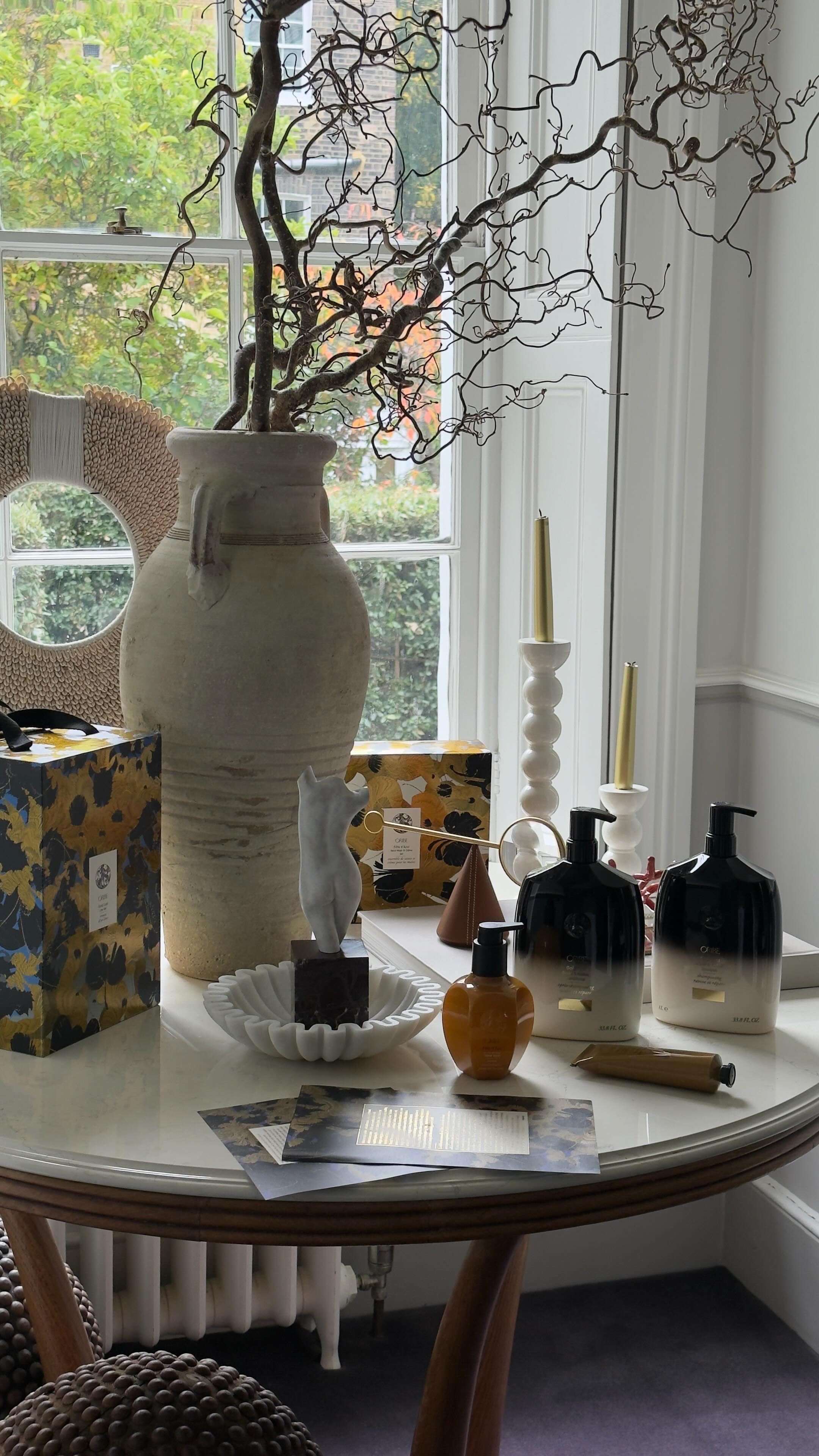 Instagram post by @peonylim for Oribe. Caption reads: @Oribe x Kustaa Saksi Holiday Collection 
 
Oribe....