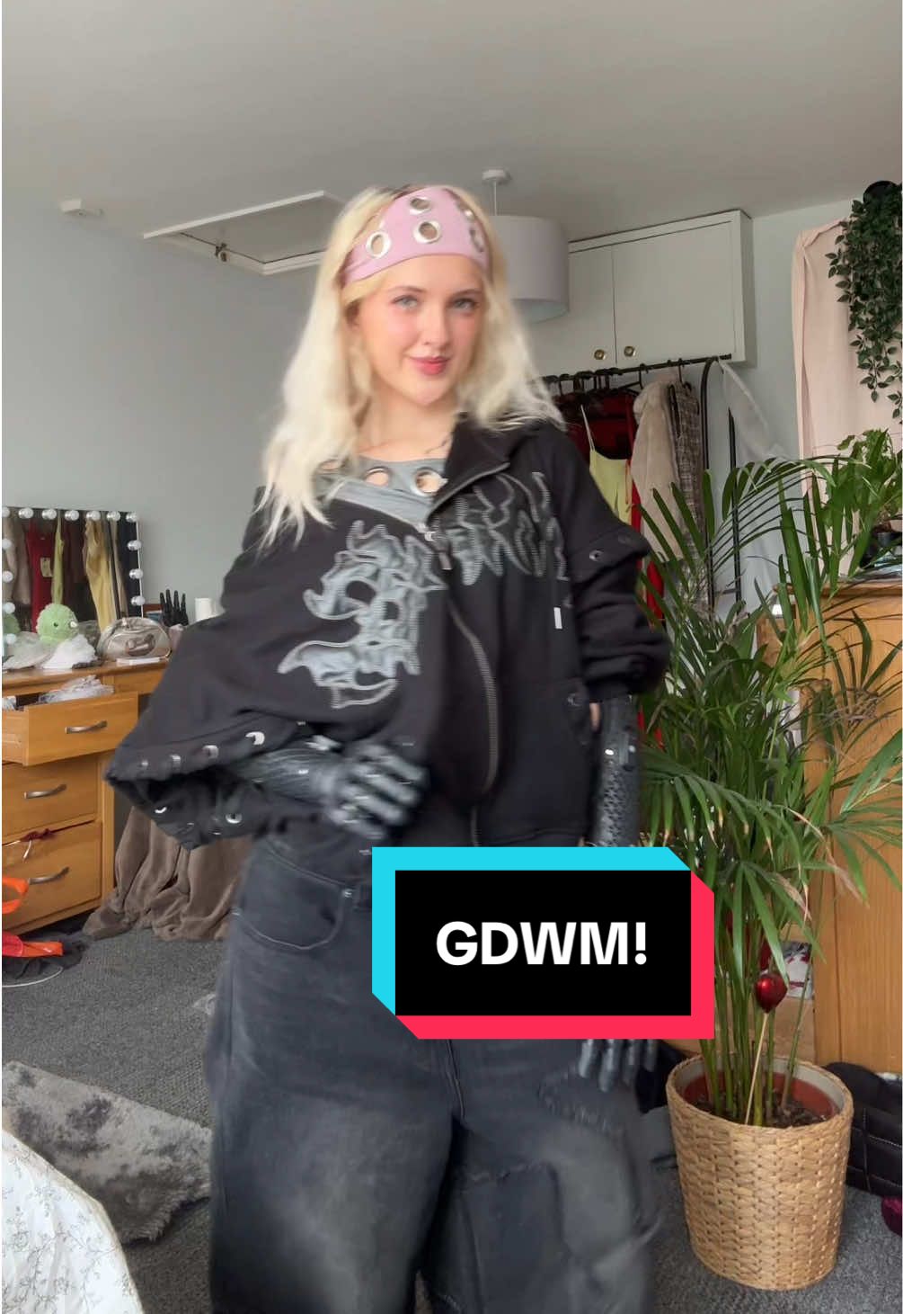 TikTok post by @tillylockey for Minga London. Caption reads: I LOVEEE outfits with personality!!!!💗🖤 Thank....