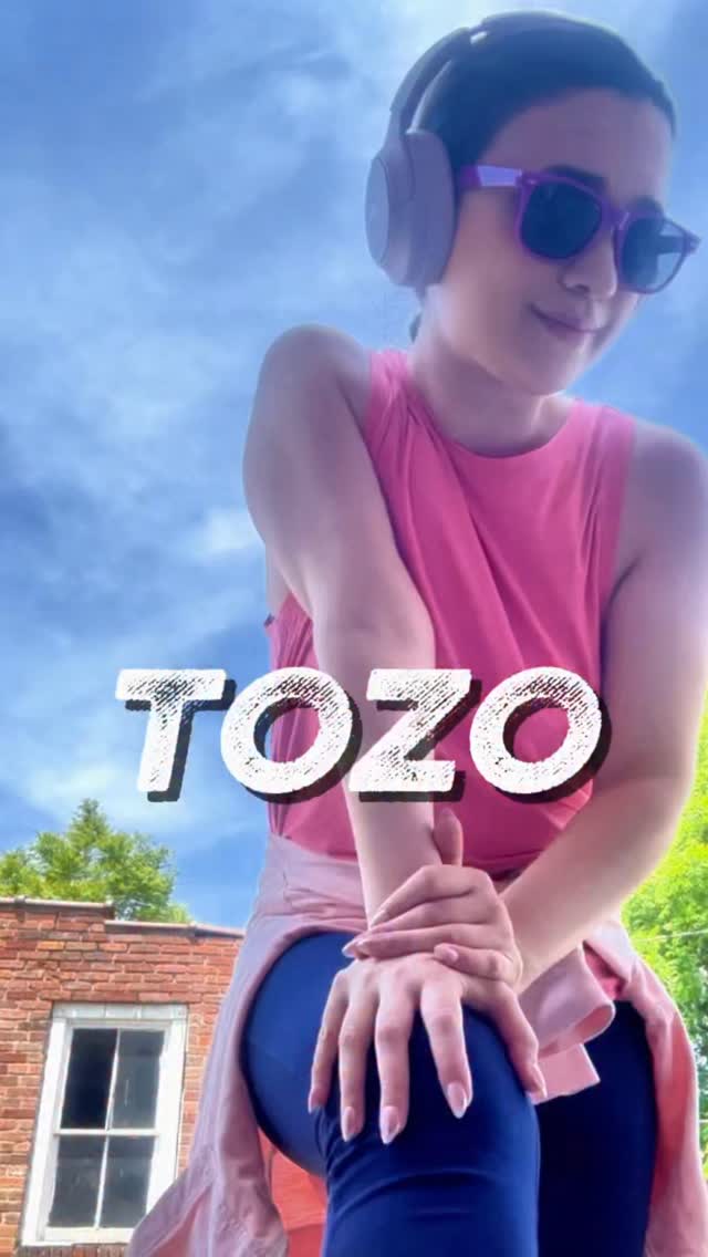 Instagram post by @ugc.bypera for TOZO. Caption reads: [...] headphones to create our own little world....