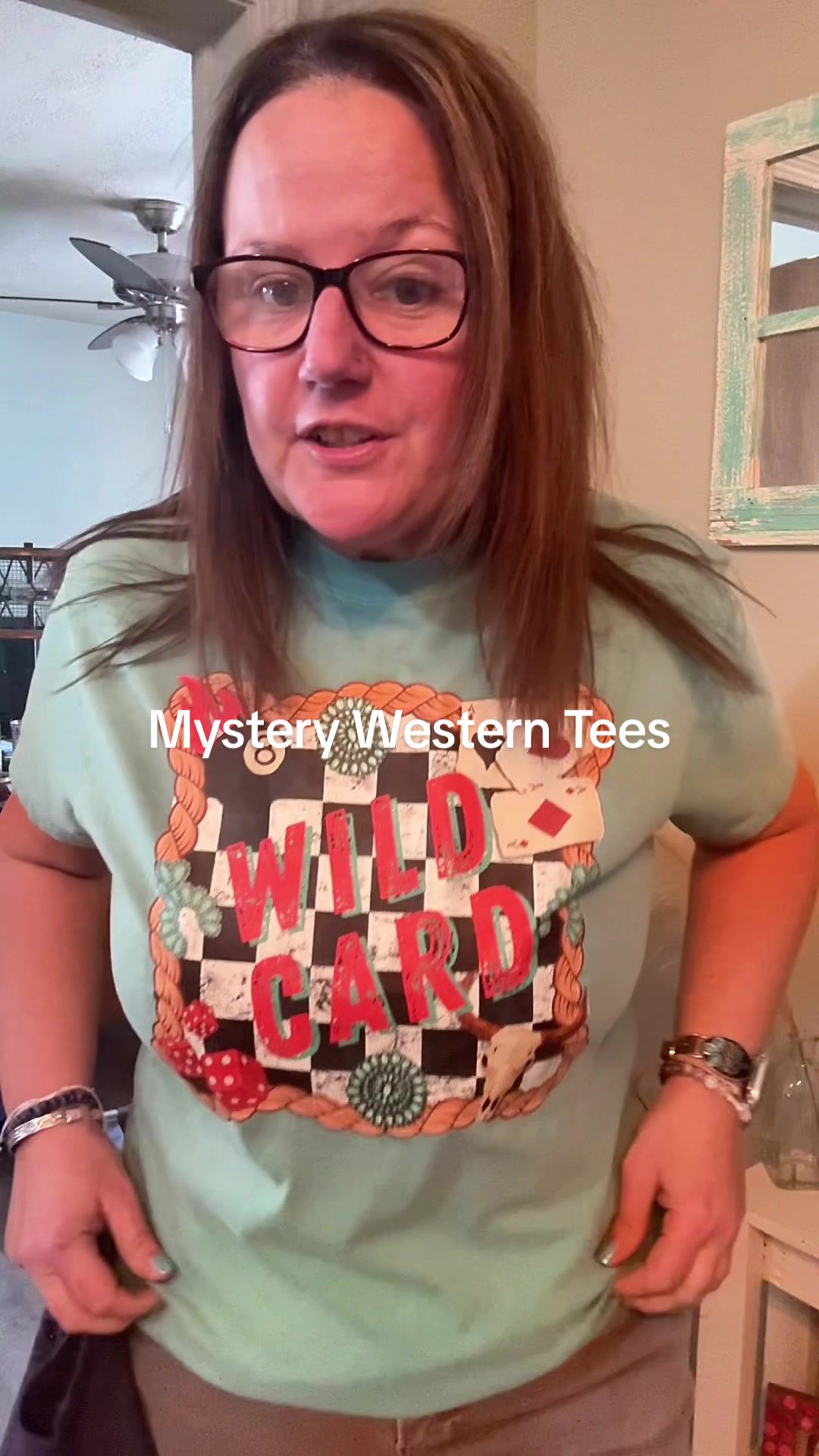 TikTok post by @staciejeanne_ for Dani Morgans. Caption reads: When the mystery tee bundle gives cowgirl vibes!....