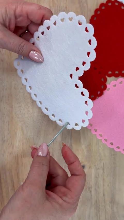 Instagram post by @julieswreathboutique for Hobby Lobby. Caption reads: [...] adding wired Valentine ribbon from Hobby....