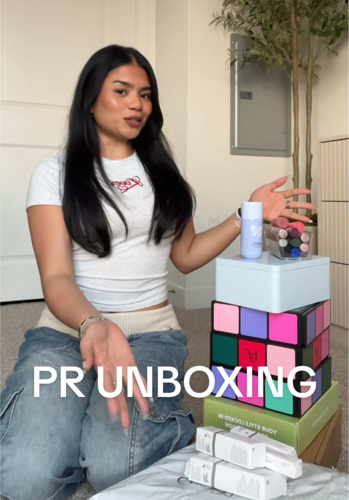 TikTok post by @zairayzabelleee for Oribe. Caption reads: [...] Ordinary @Benefit Cosmetics @Miu Miu....