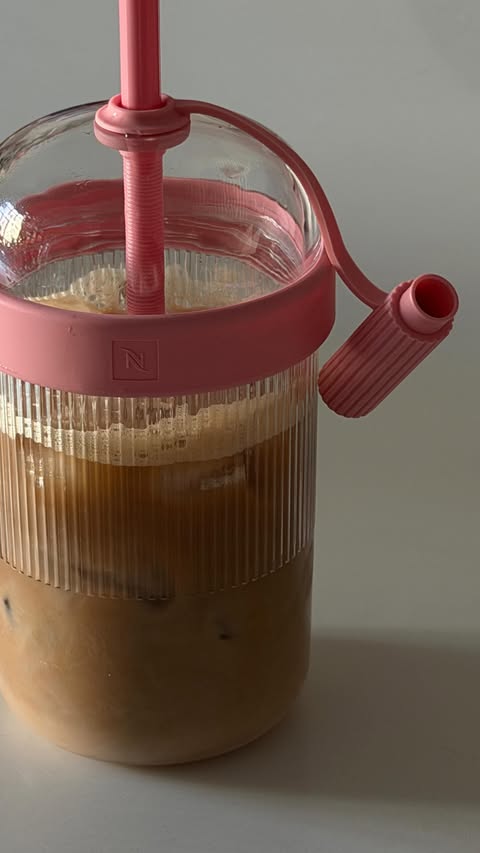 Instagram post by @mariaaamarzullo for Nespresso. Caption reads: [...] to my gorgeous pink iced tumbler from....