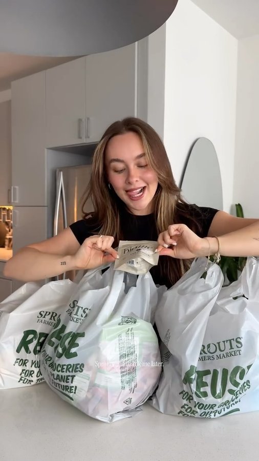 Instagram post by @cailastevensss for Bio.me. Caption reads: [...] me @sprouts 🛒🌿 I’m so excited that @bio.me....