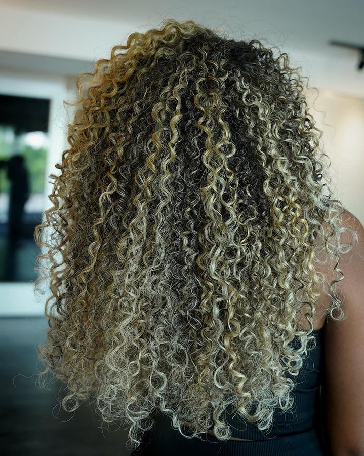 Instagram post by @jacquie_beauty for Beauty Launchpad. Caption reads: Check out these colorful curls from Beauty....