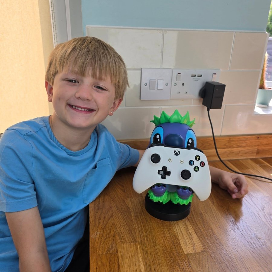 Instagram post by @life_with_the_whites_ for EXG Pro. Caption reads: [...] buddy — the Stitch Hula Cable Guy from....