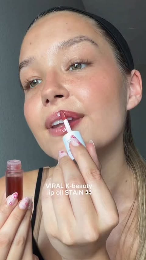Instagram post by @imgabriellahall for nooni. Caption reads: [...] lip stain 😏💋✨#lipoil #lipstain #makeup....