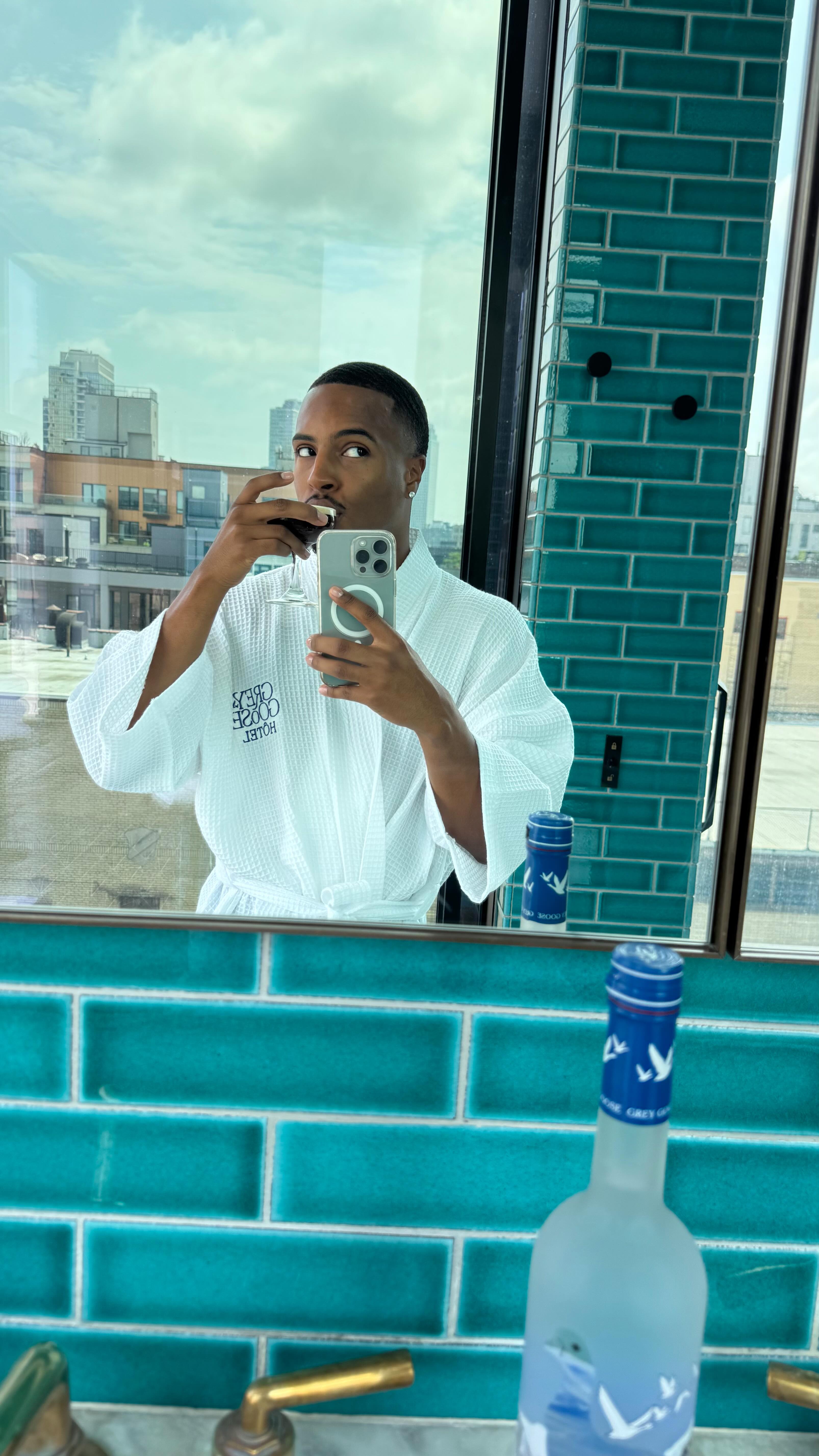 Instagram post by @imdrebrown for Grey Goose. Caption reads: Went on a date and we had the best staycation of....