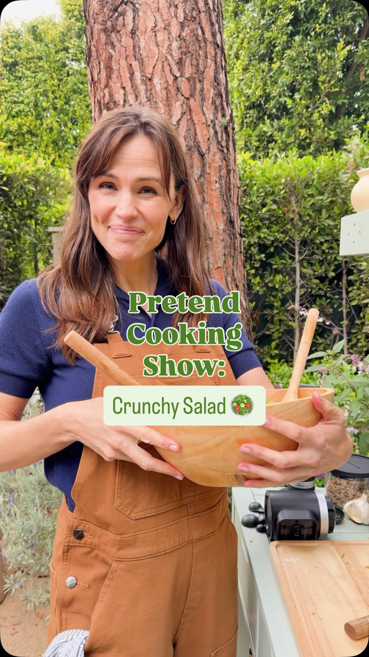 Instagram post by @jennifer.garner for KitchenAid. Caption reads: #PretendCookingShow: Crunchy Salad. 🥗☀️ Today I....