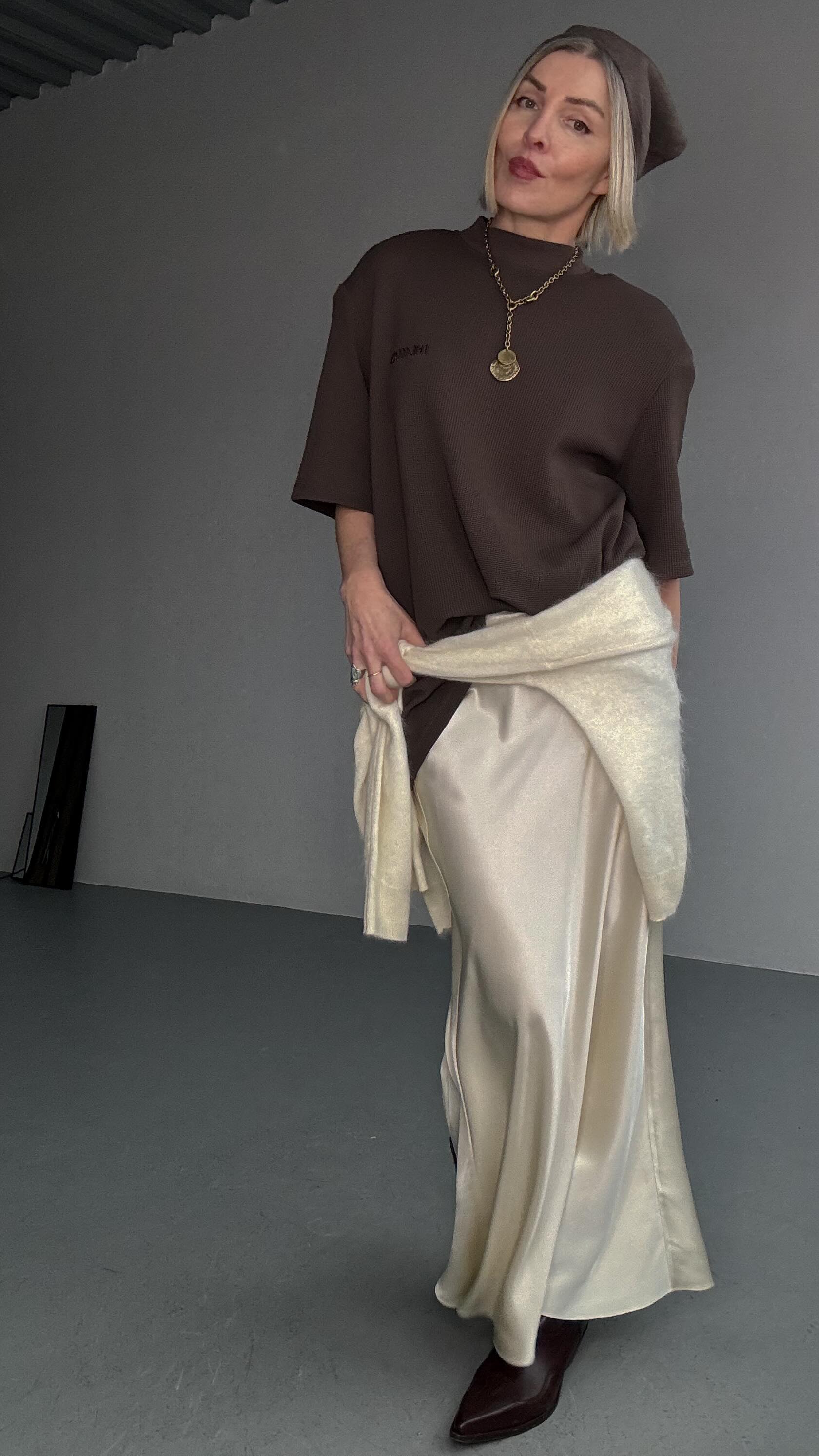 Instagram post by @stylemeyara for LilySilk. Caption reads: Silk skirts aren’t just for delicate looks. Here’s....