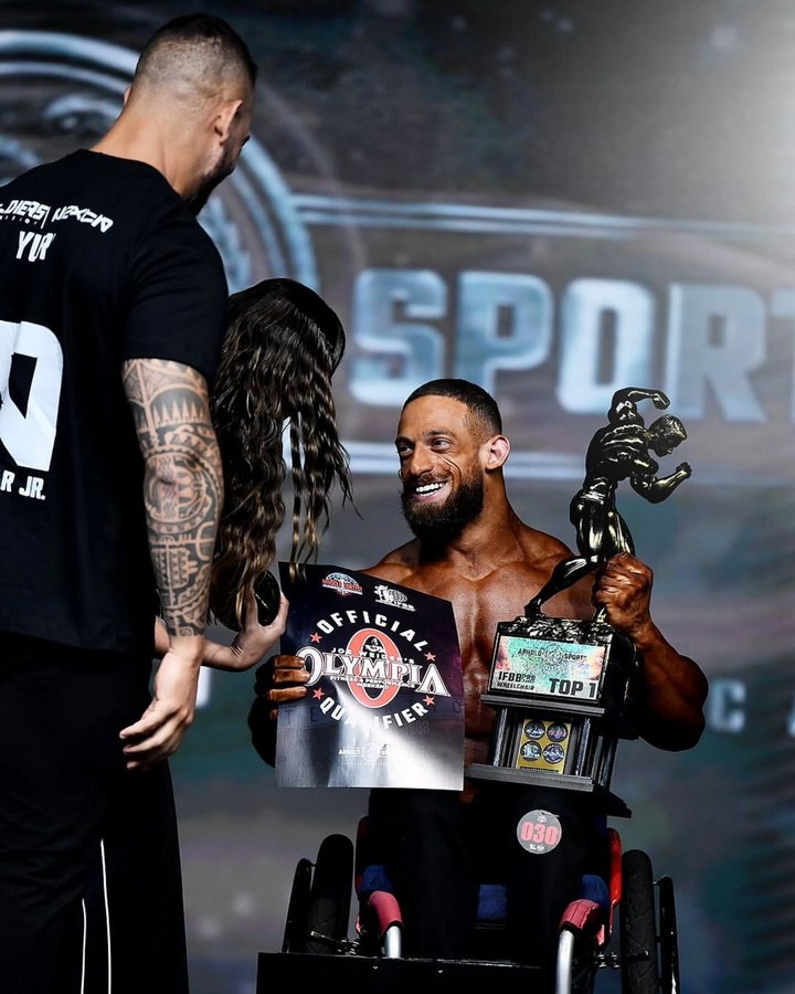 Instagram post by @gorilaalbinopro for FLEX Magazine. Caption reads: IFBB Pro Wheelchair Presented by....