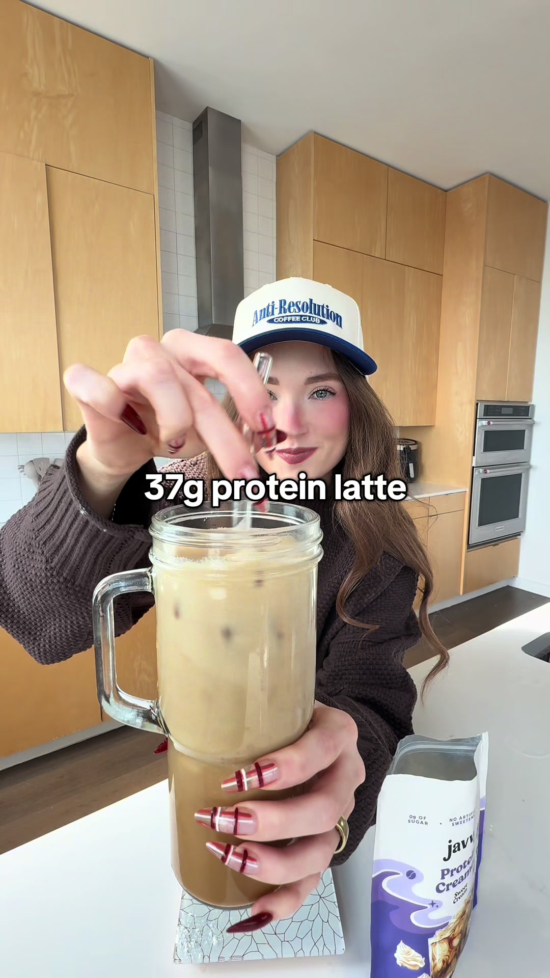 TikTok post by @kellybstory for Javy Coffee. Caption reads: In 2026 y’all know we’re saying NO to unrealistic....