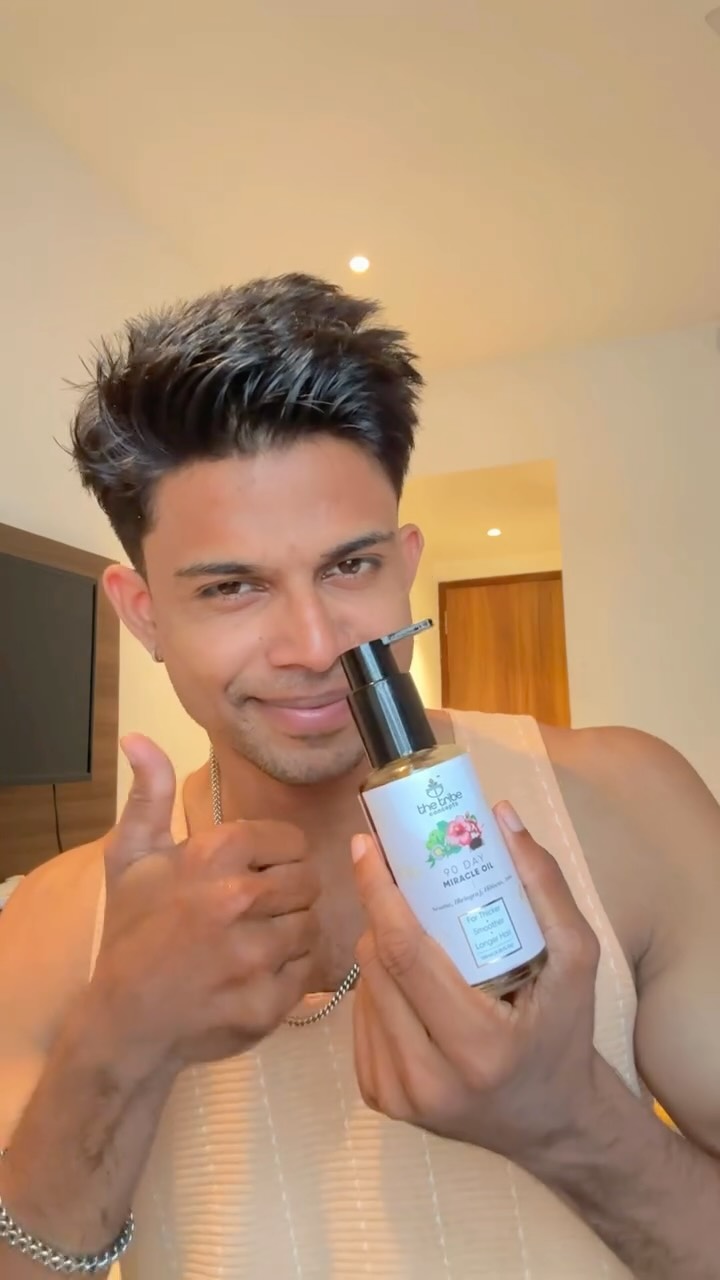 Instagram post by @anand_the_alpha for The Tribe Concepts. Caption reads: The Tribe Concepts 90 Day Miracle Hair Growth Oil....