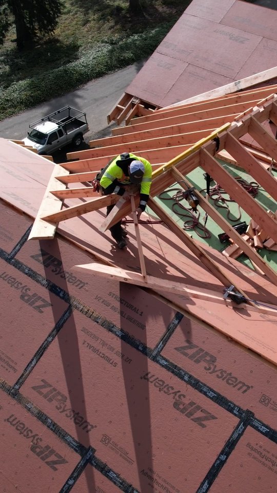 Instagram post by @awesomeframers for TRUEWERK. Caption reads: Roof framing in the sunshine. Guess the time of....