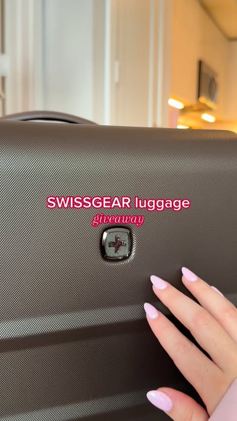 Instagram post by @fifiimarie for SWISSGEAR. Caption reads: [...] DM*

hi everyone! i’m partnering with....