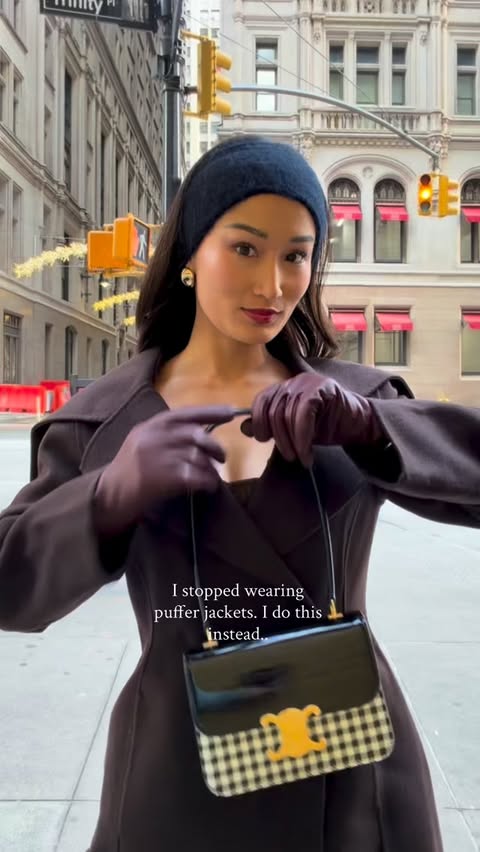 Instagram post by @isabeltan for J.Crew. Caption reads: Puffer vest + wool coat. How I Dress Chic When....