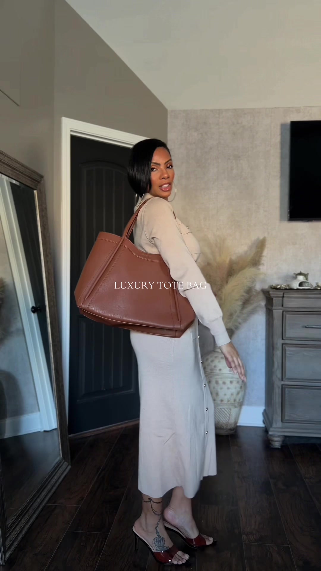 TikTok post by @iamsamanthabraham for NEWBELLA. Caption reads: @NEWBELLA luxury tote bag is always top tier with....