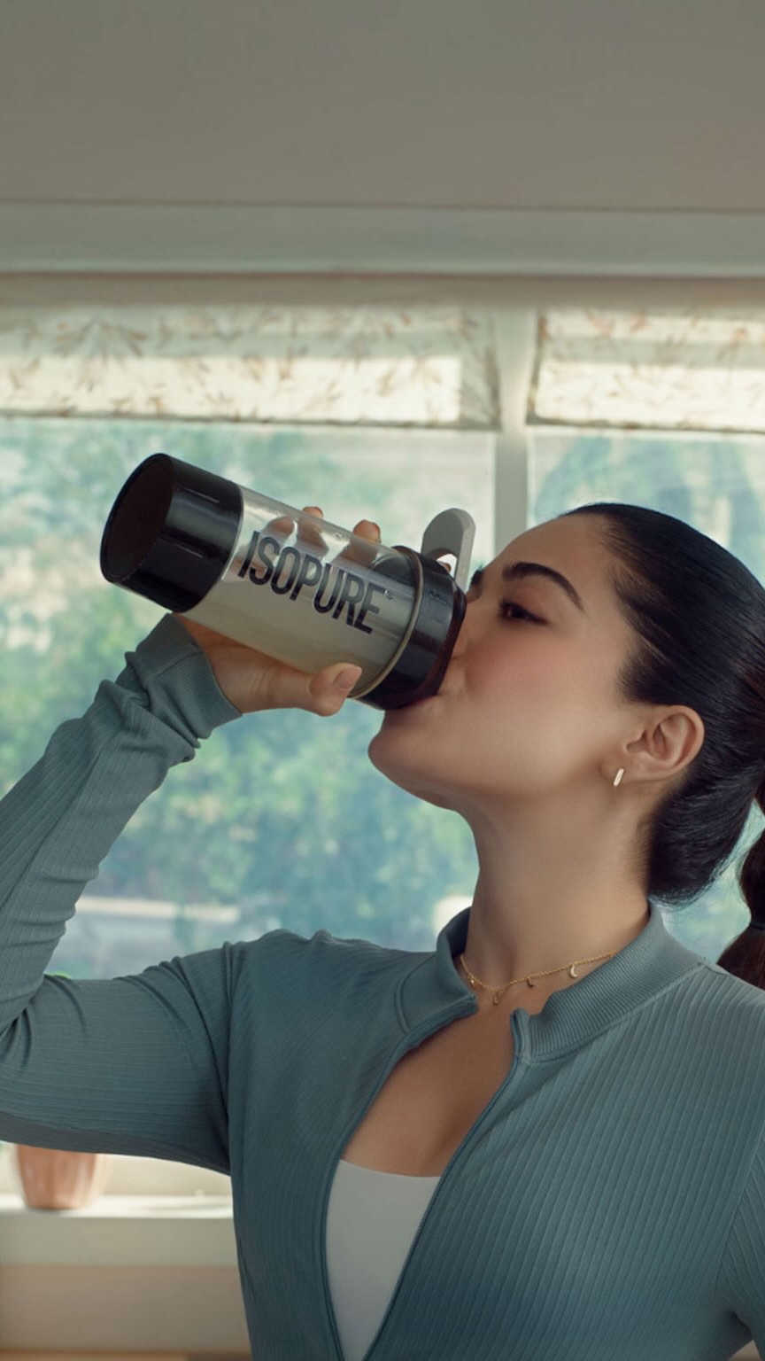 Instagram post by @rashmika_mandanna for Isopure. Caption reads: Long days, travels, endless hours in front of the....