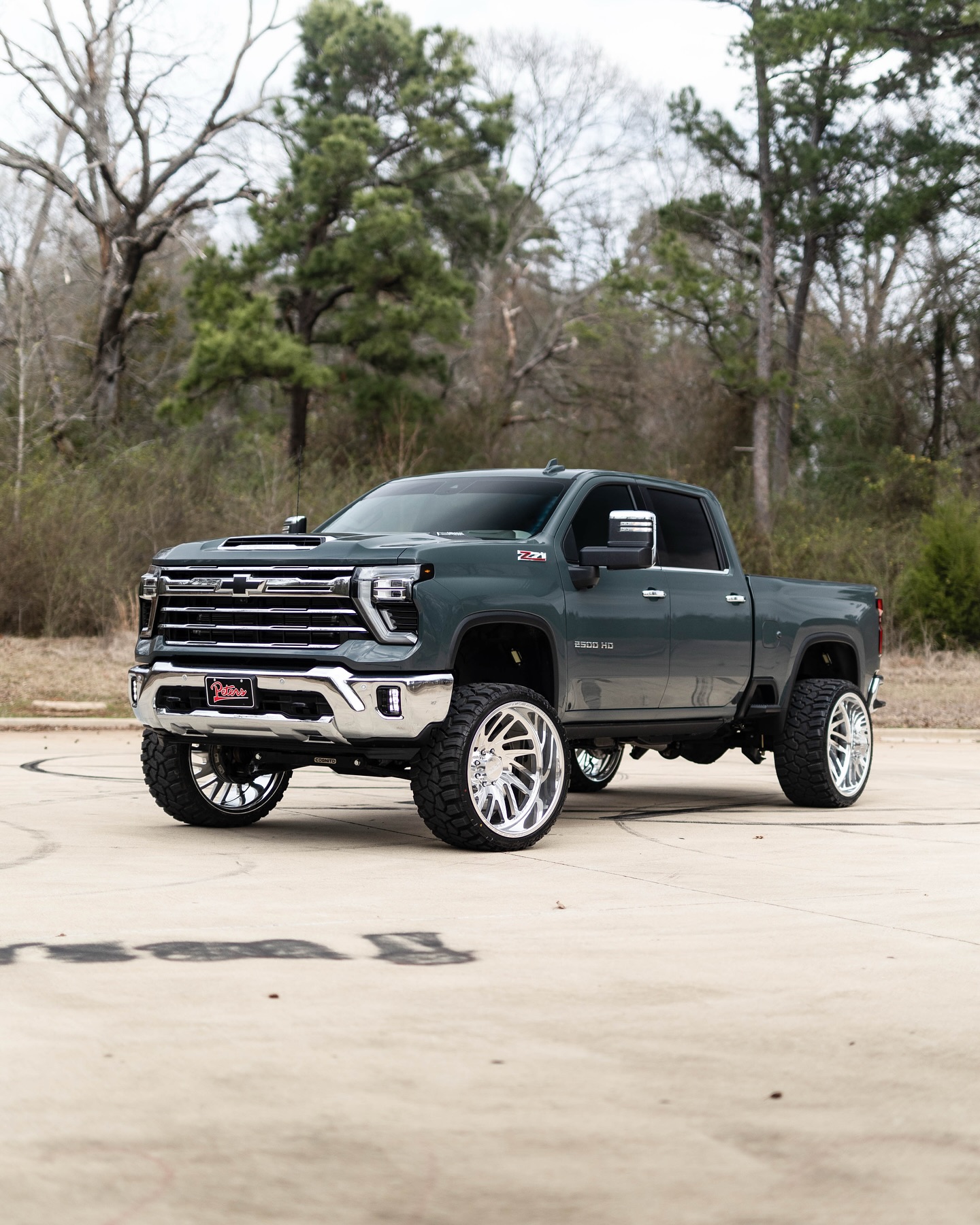 Instagram post by @elite_robbybunch for chevrolet. Caption reads: @peters_elite_autosports with the 2024 Chevy 2500....
