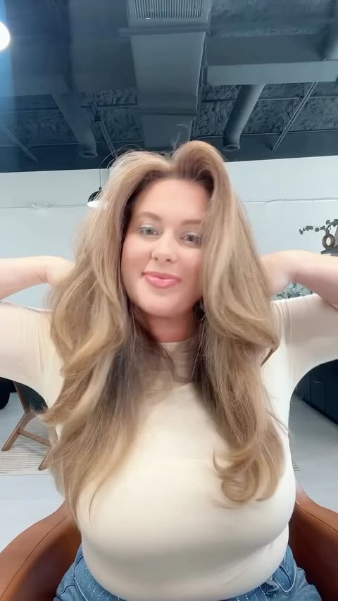 Instagram post by @the_hairstylist_lady for L'ange Hair. Caption reads: Meet the new Axia Blow Dryer from @langehair....