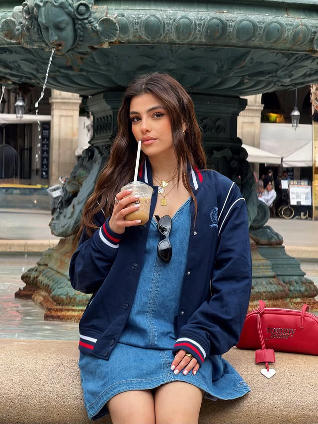 Instagram post by @giuls.izzo for Tommy Jeans. Caption reads: #adv Walking through Barcelona in my @tommyjeans....