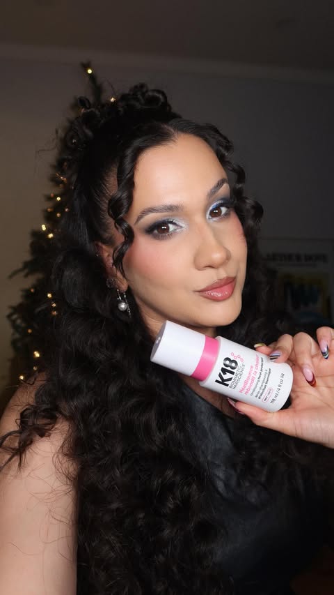 Instagram post by @desireerose__ for K18 Hair. Caption reads: Your holiday hair inspo has officially arrived....