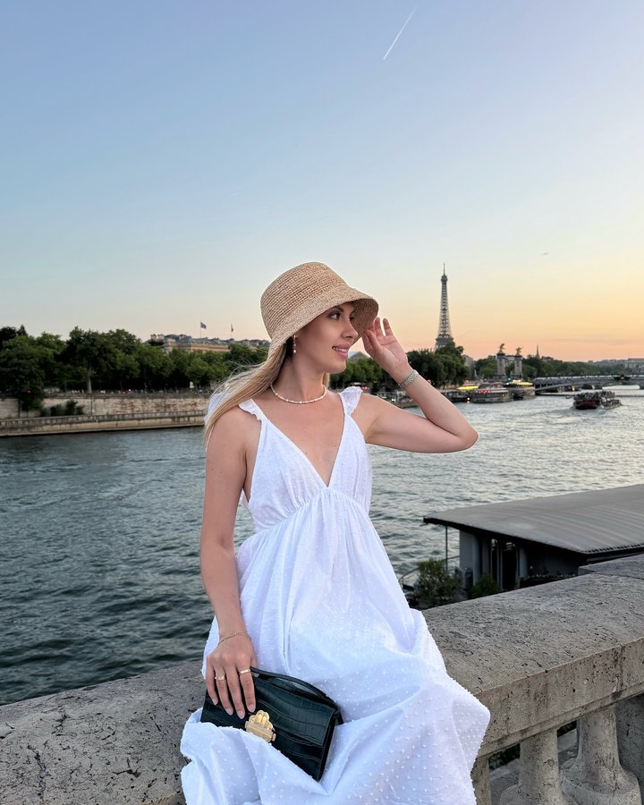 Instagram post by @juliamotoryha for Homebodii. Caption reads: [...] sunset time in Paris ✨ 

Dress: @homebodii....