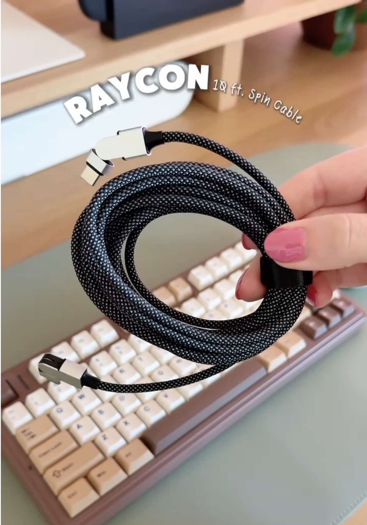 TikTok post by @marisasdesk for Raycon. Caption reads: [...] #techfinds #usbccable #magicspincable....