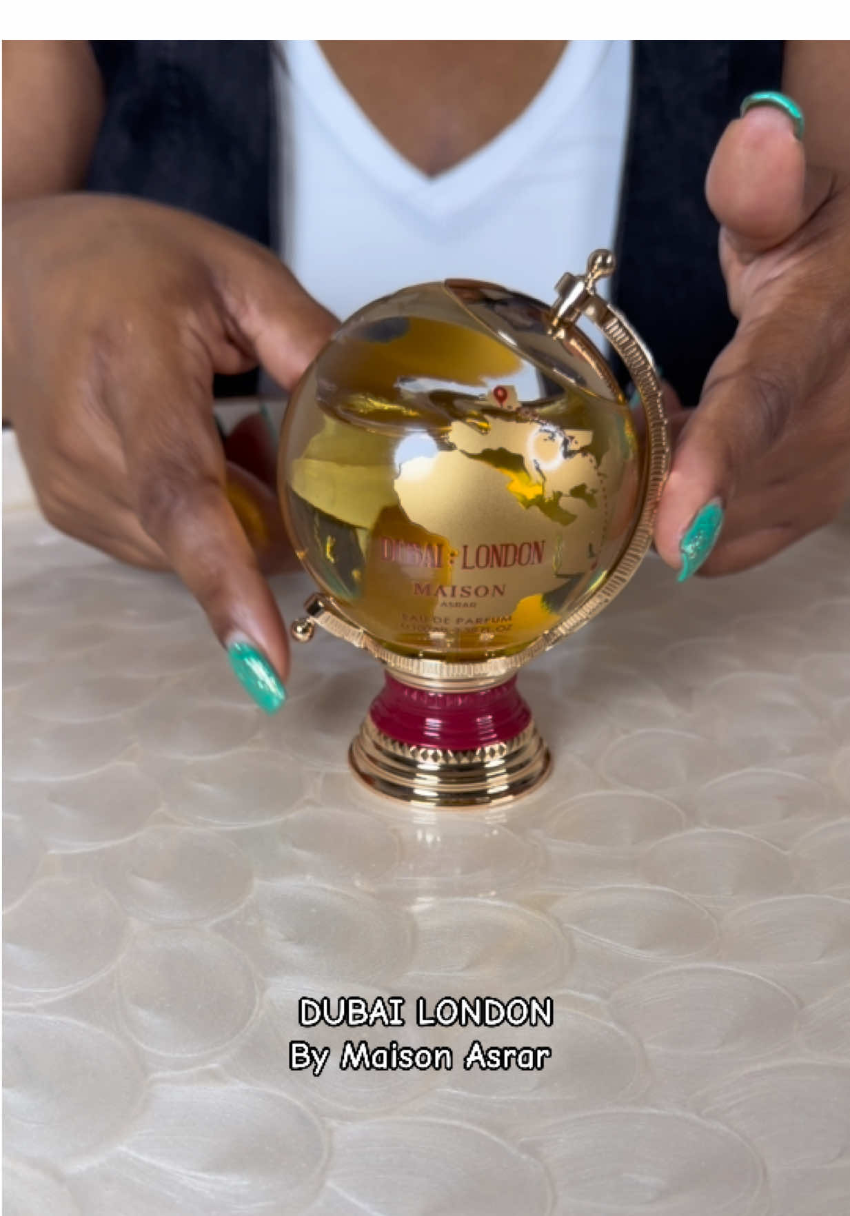 TikTok post by @tiffanysolotraveldiary for Maison Asrar. Caption reads: Dubai London, by Maison Asrar is a fresh aromatic....
