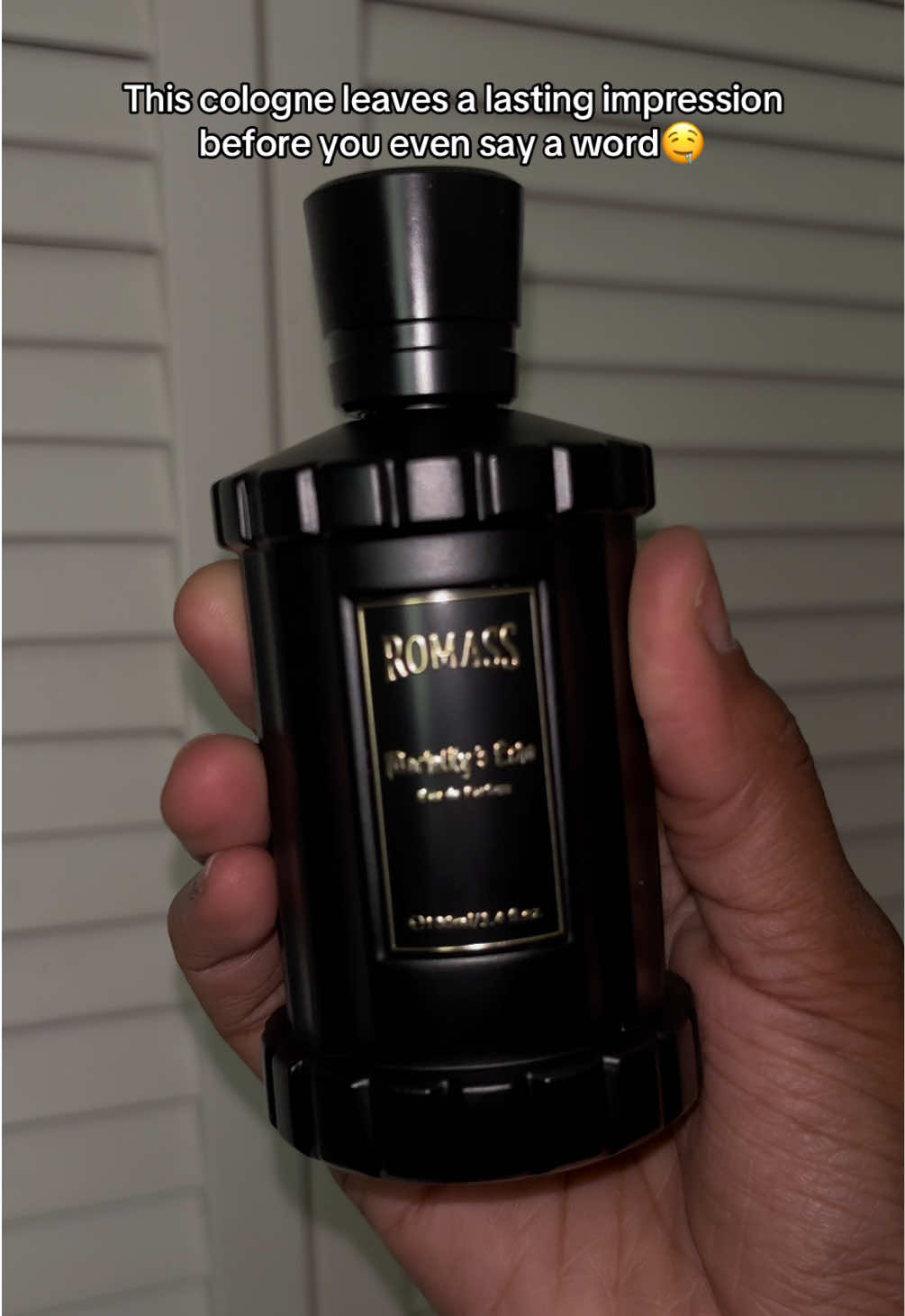 TikTok post by @awoosworld for Romass. Caption reads: Get this cologne for your man🖤 @ROMASS US....