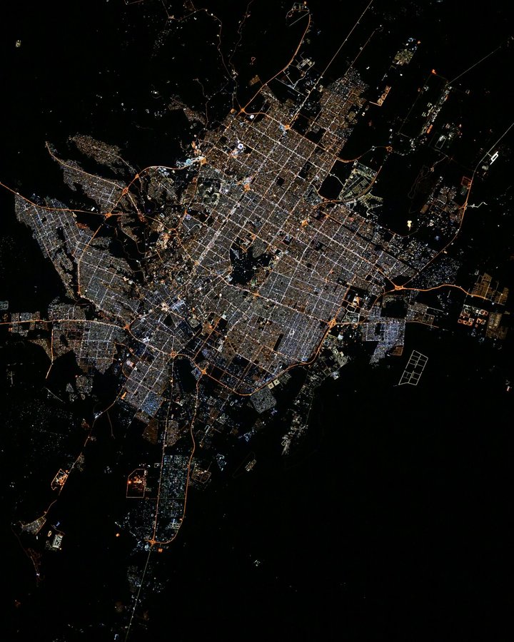 Instagram post by @astro_pettit for NASA. Caption reads: Riyadh, capital of Saudi Arabia, seen at night....