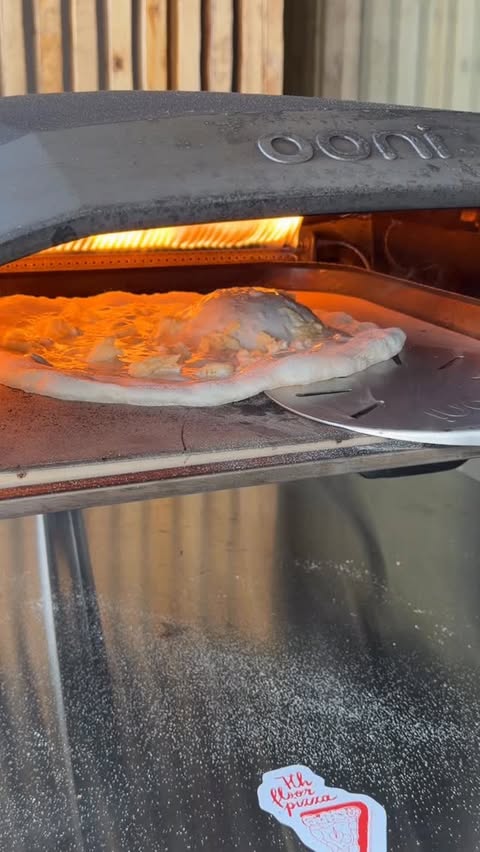 Instagram post by @7thfloorpizza for Ooni. Caption reads: [...] (4°C) 🔥 Baked in the Ooni Koda 16 at 430°C....