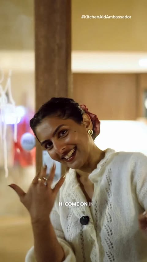 Instagram post by @bazaar_nyc for KitchenAid. Caption reads: Come with me to host a Friendsgiving dinner party....