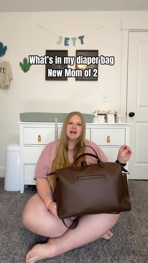 Instagram post by @mikaylaminer for MINA BAIE. Caption reads: Loving my new diaper bag from @minabaie 🤍 what....