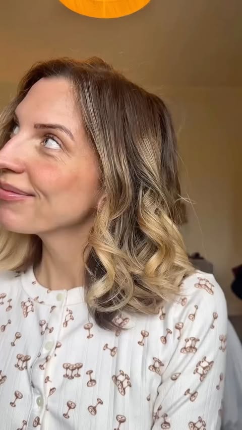 Instagram post by @busymumglow for TYMO Beauty. Caption reads: If curling your hair feels impossible… this tool....