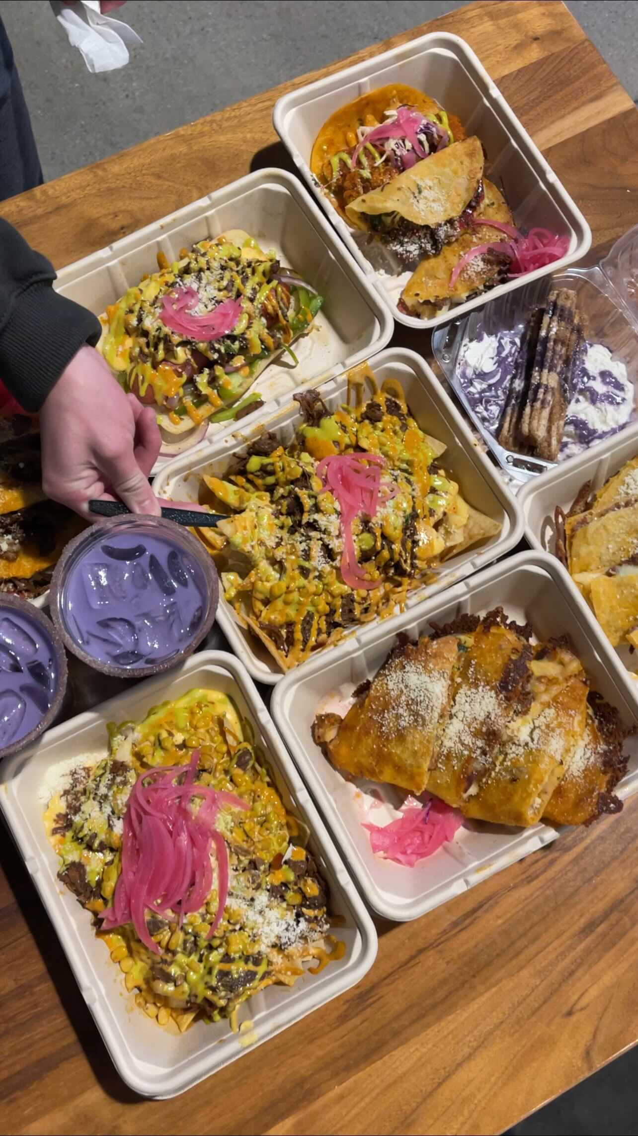 Instagram post by @atlasofeats for Zagat. Caption reads: Chipotle Hot Chicken X Birria X Nachos X....