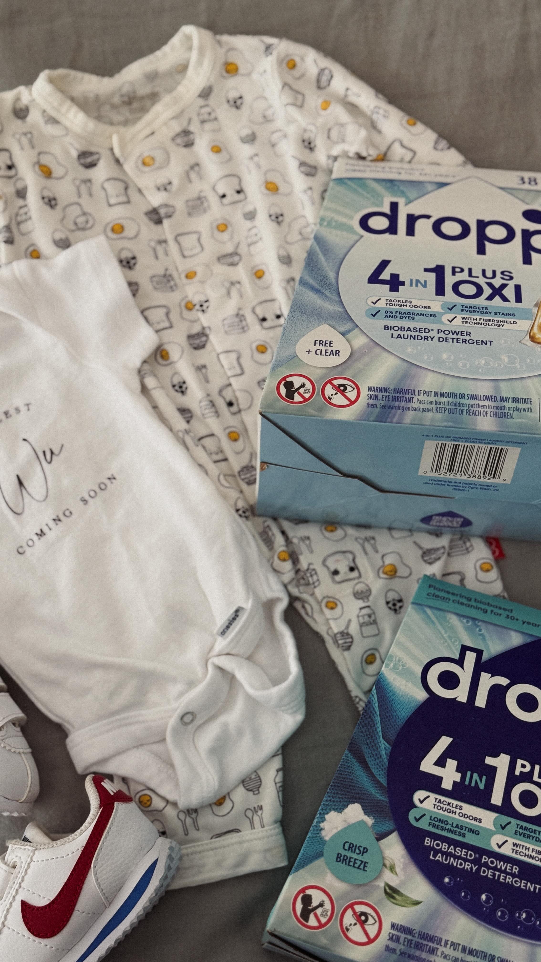 Instagram post by @thedailyjenny for Dropps. Caption reads: Baby prep means washing all the tiny clothes, and....