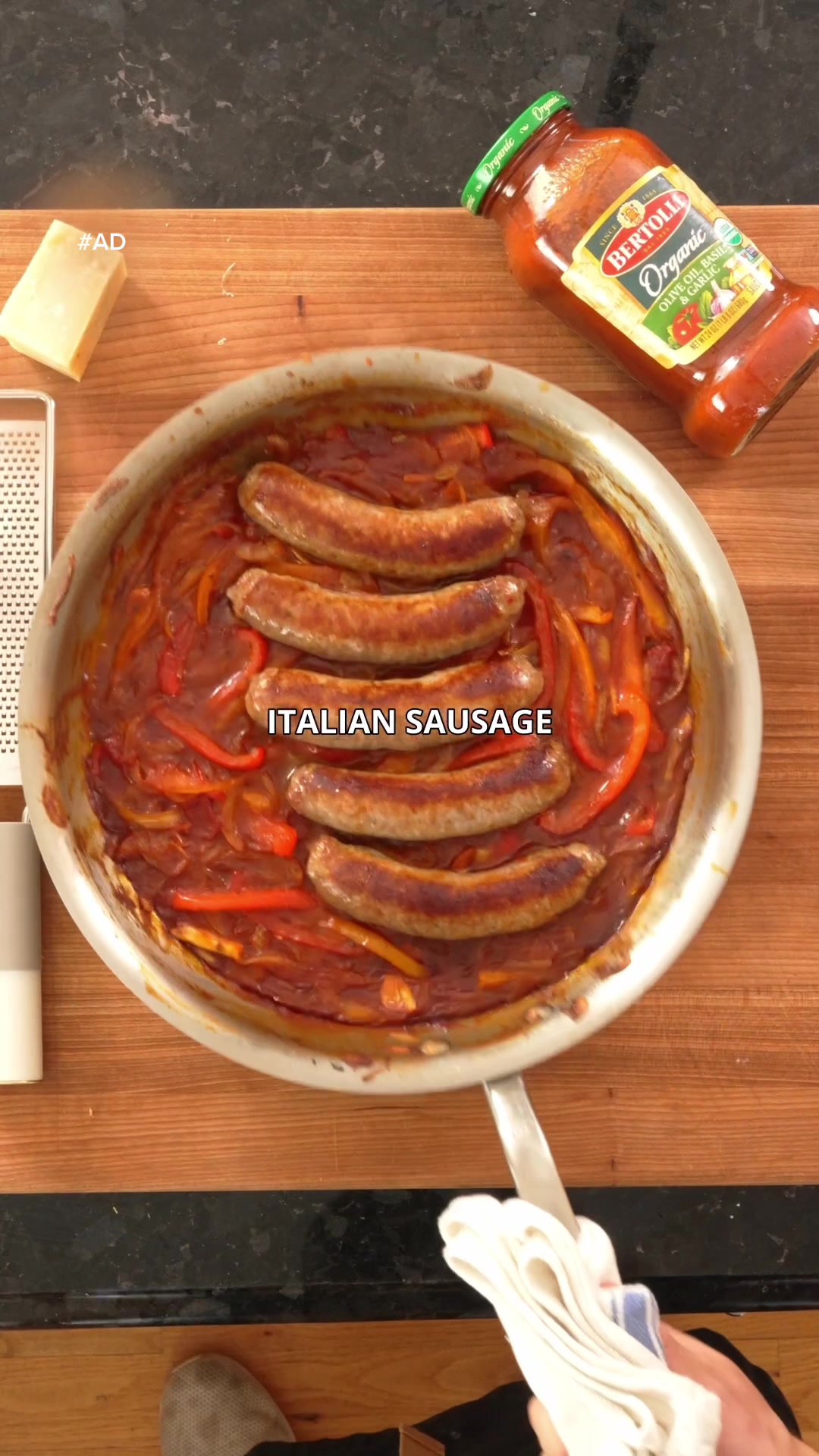 TikTok post by @rafifronz for Bertolli. Caption reads: Sausage and peppers over creamy polenta with....