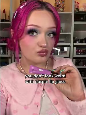 TikTok post by @linsmakeuplooks for Danessa Myricks Beauty. Caption reads: [...] with a purple lip 🤓💜 @DanessaMyricksBeauty....