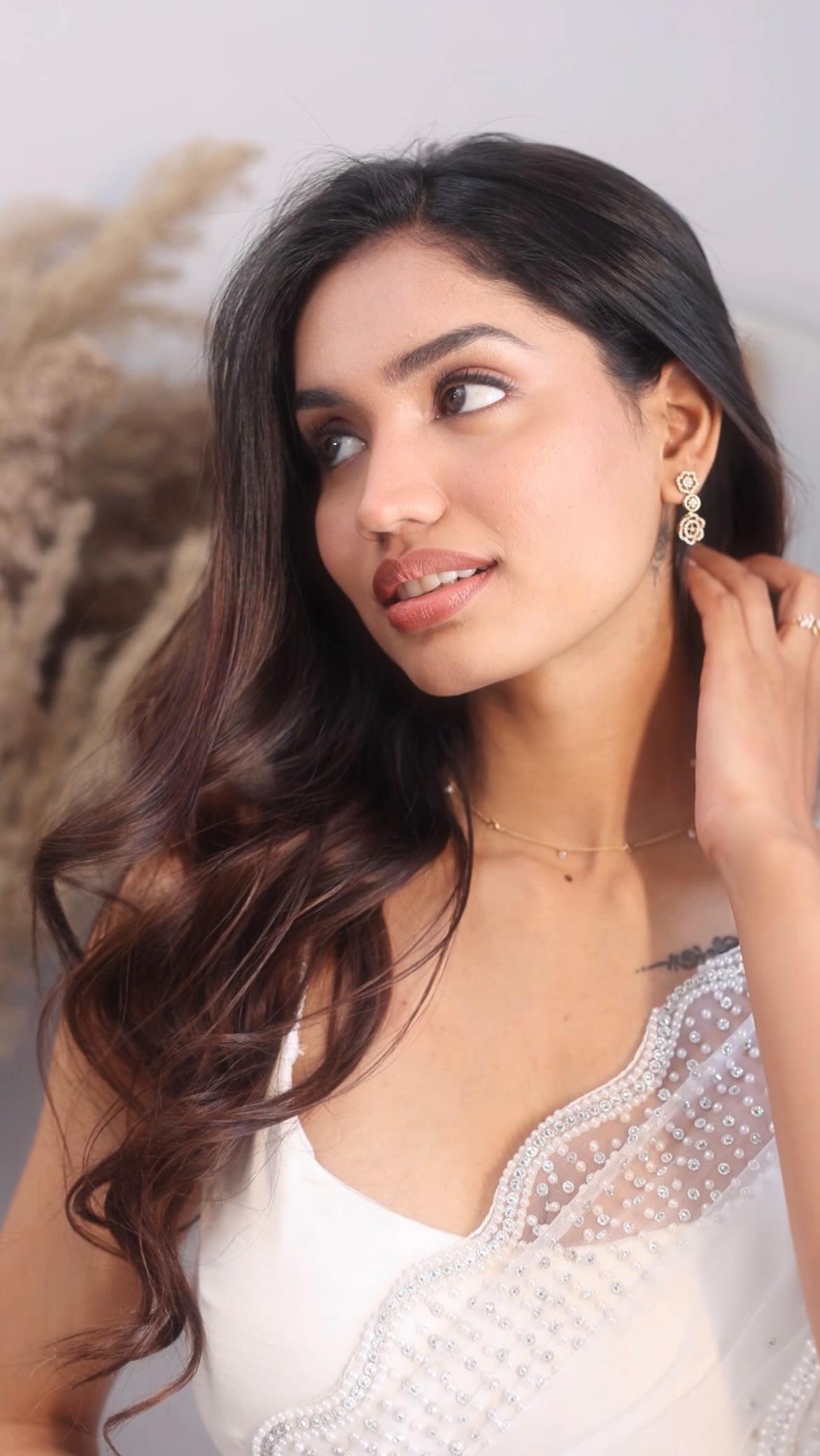 Instagram post by @vaishnaviishetty_ for CaratLane. Caption reads: #Ad Elevate your elegance with jewellery that....