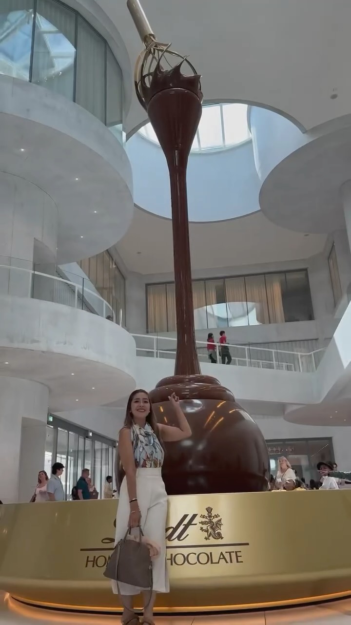 Instagram post by @happyongpauco_tiu for Lindt. Caption reads: If you’re a chocolate lover, this iconic stop is a....