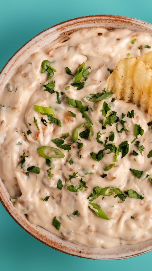 Instagram post by @sweetsimplevegan for Follow Your Heart. Caption reads: Dairy-Free Sour Cream and Onion Dip 🧅 with....