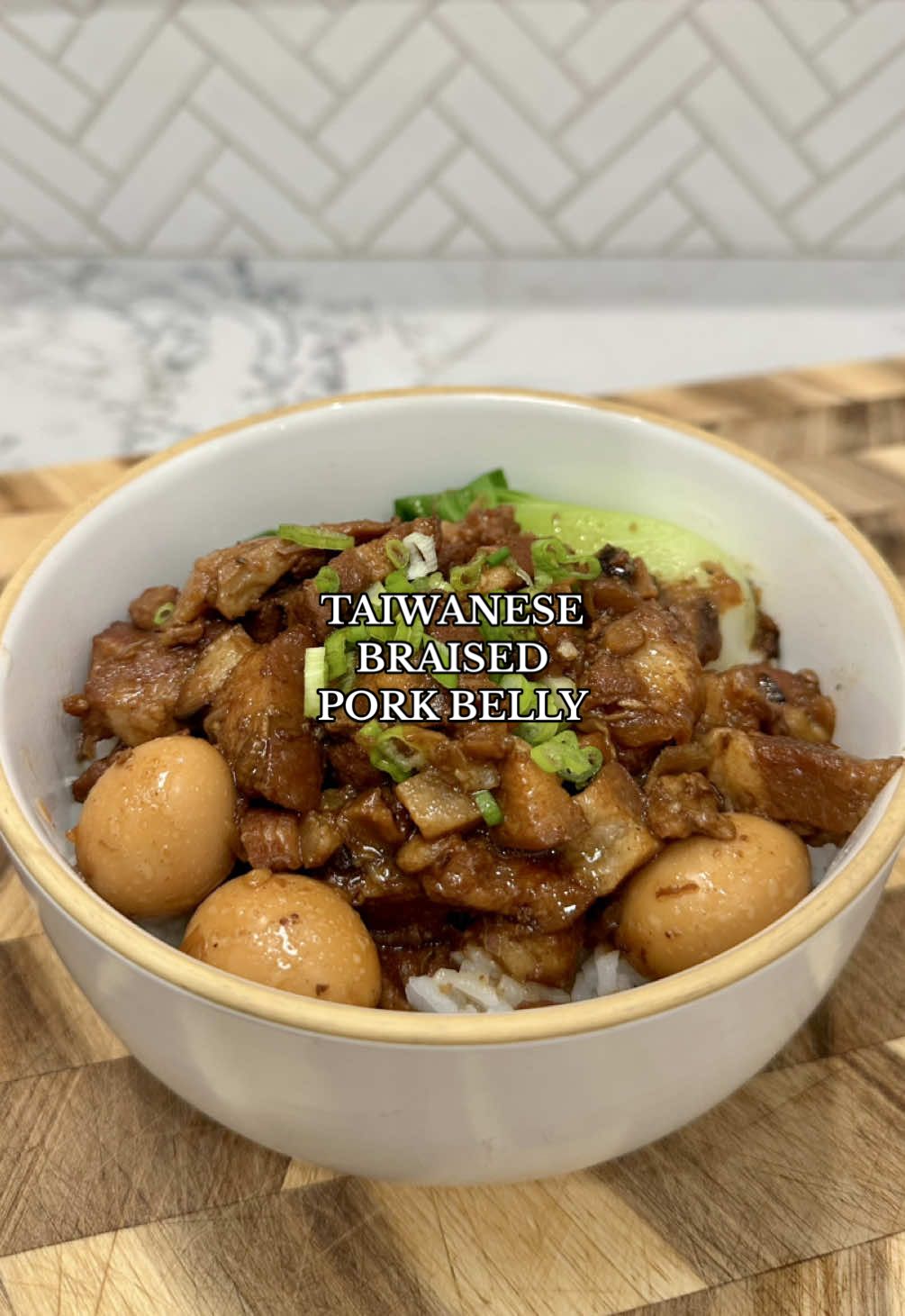 TikTok post by @thespicyjuju for Instant Pot. Caption reads: Taiwanese Braised Pork Belly 🥓🧄 Visit....