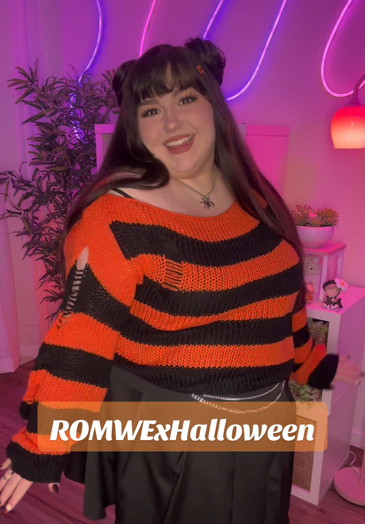 TikTok post by @thepeachykat for ROMWE. Caption reads: 🎃 Feeling the SPOOKY season with my new ROMWE....