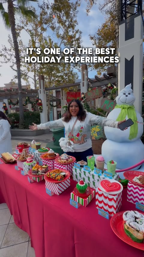 Instagram post by @latinafoodiela for Universal Studios Hollywood. Caption reads: Meeting the Grinch was unexpectedly one of the....