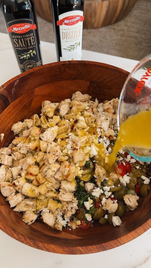 Instagram post by @broccyourbody for Mezzetta. Caption reads: NEW Chickpea Chopped Salad with Grilled Chicken....