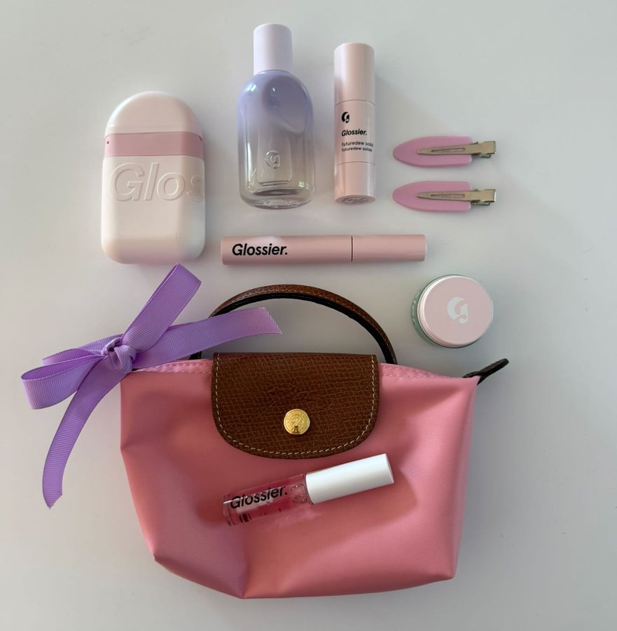 Instagram post by @carrieanne_ for Glossier. Caption reads: Sotd 💜🪻🎀✨ @glossier You Fleur The Original You....