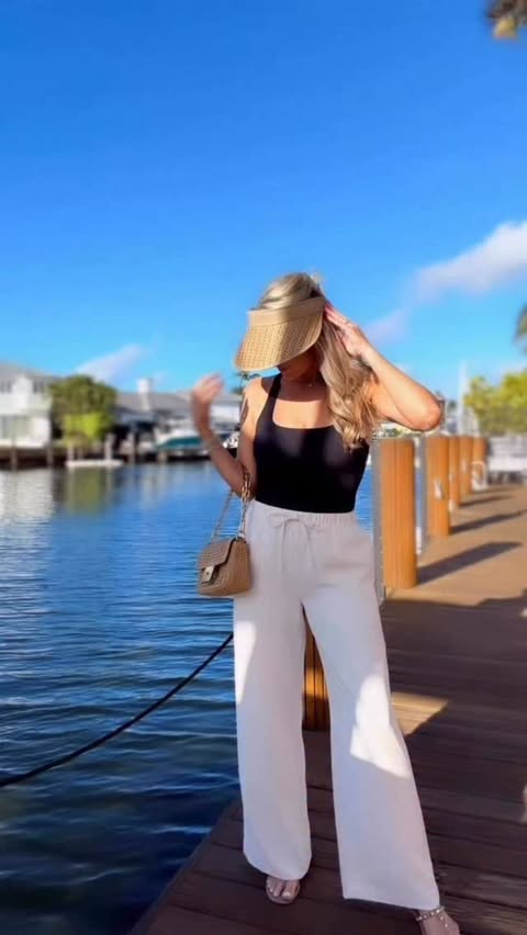 Instagram post by @fashionablyjess for Eric Javits. Caption reads: [...] Kokomo Visor and western straw hat by....